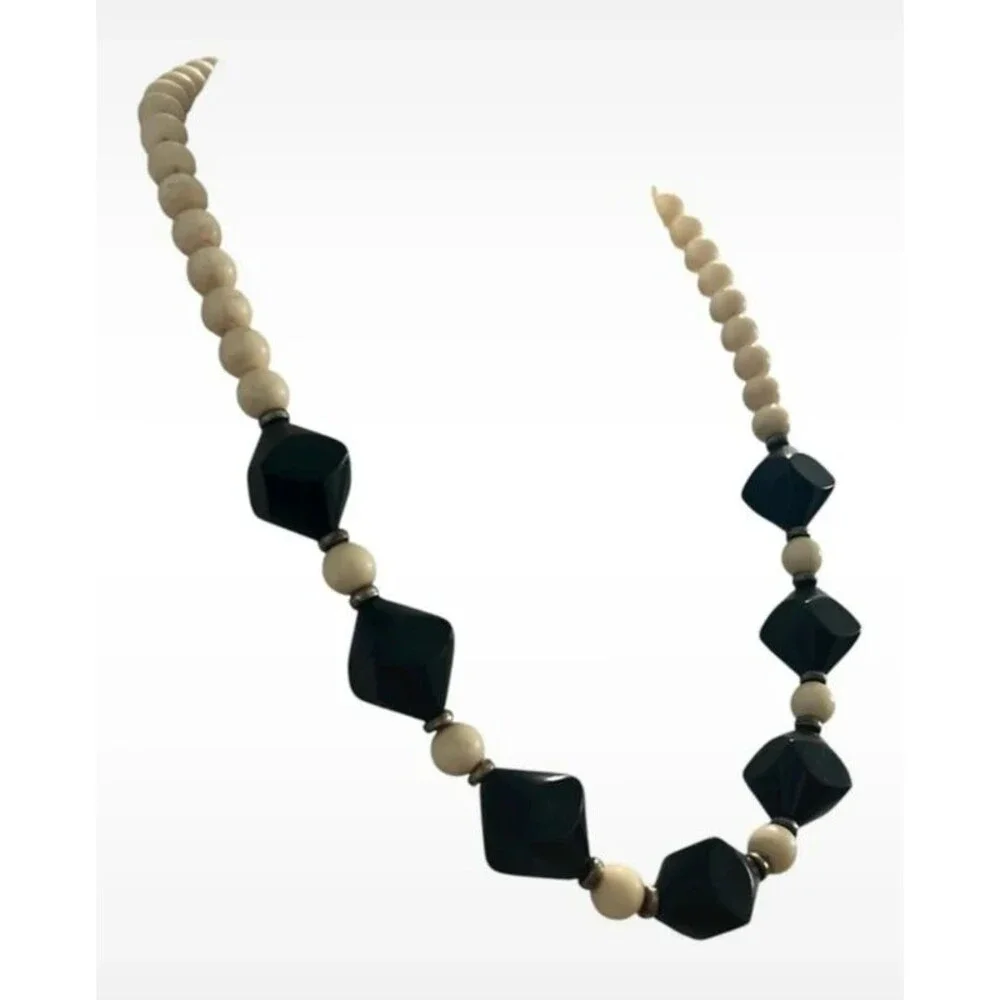 Vintage beaded necklace graduated sizes 22” long Cream and black